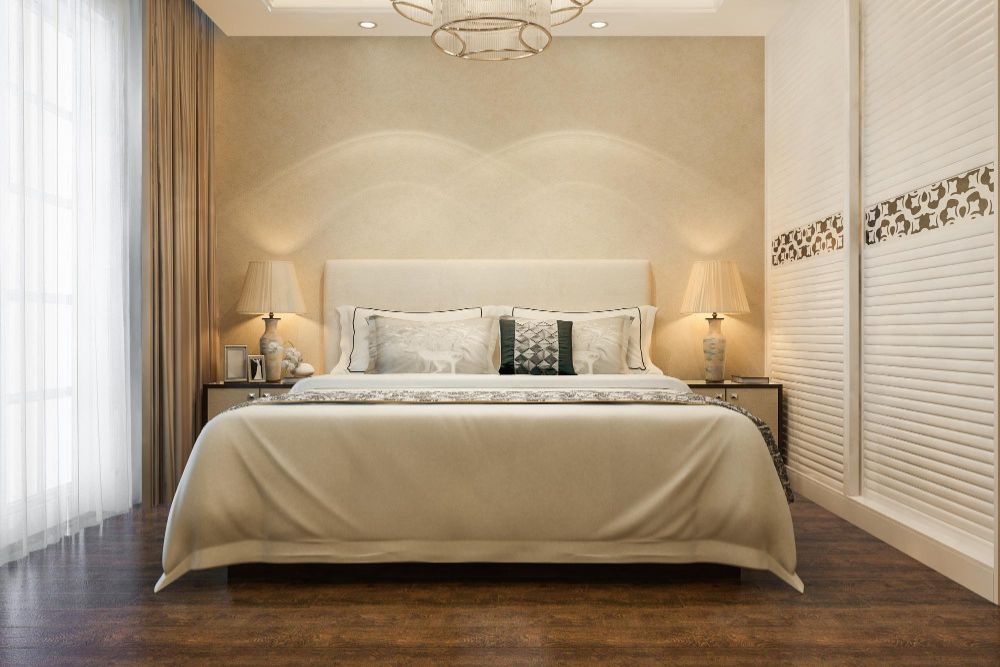 Minimal modern bedroom with soft lighting and warm décor.